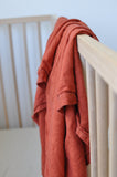 bright terracotta linen swaddle